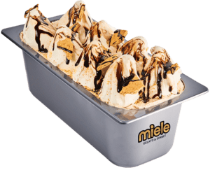 5 quart metal container of gelato decorated with tall peaks, chocolate sauce, and graham crackers